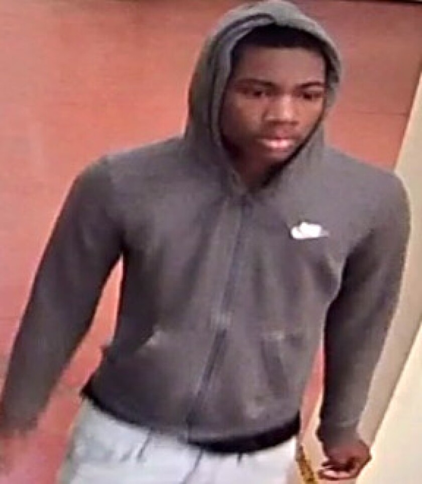 Video still of a Blue Line train robbery suspect near the Grand Avenue station | Chicago police