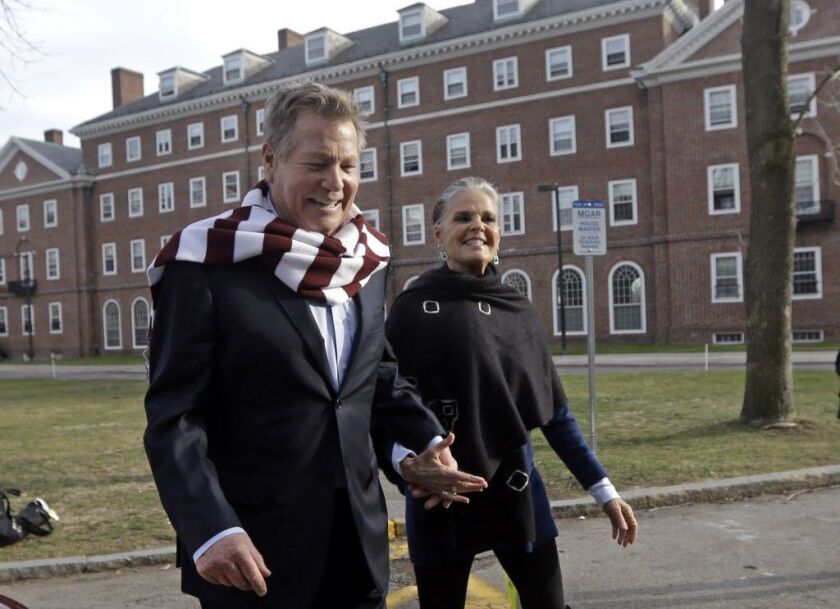 Actors Ryan O’Neal and Ali MacGraw walk on the campus of Harvard University in Cambridge, Mass., Monday Feb. 1, 2016, more than 45 years after the release of their 1970 classic “Love Story.” The duo, now in their 70s, currently are co-starring in a nation
