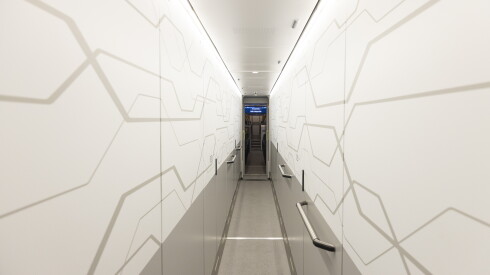 A hallway runs through the middle of the battery car powering Metra's new electric train.