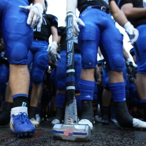 Lincoln-Way East’s Danny Scianna carries a sledgehammer onto the field. Allen Cunningham/For the Sun-Times.