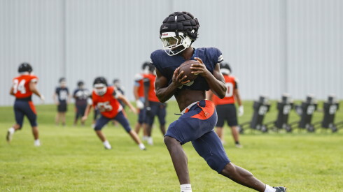 Oswego’s Ammar Banire (2) works a drill during preseason football practice.
