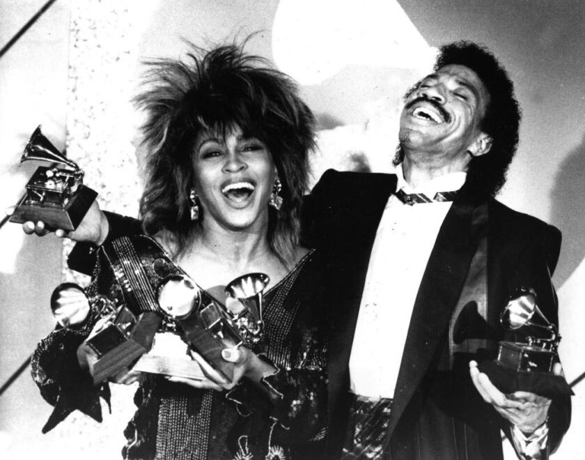 FILE – In this Feb. 27, 1985 file photo, Tina Turner, left, and Lionel Richie pose with a total of five awards between them, at the Grammy Awards show in Los Angeles, Calif. Turner won Female Pop Vocal Performance and Record of the Year for her album “Wha
