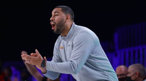 Loyola coach Drew Valentine applauds during the team’s game against Arizona State.