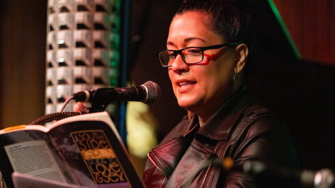 Chicago Poet Laureate Mayda Alexandra del Valle reads poems from her book during the Uptown Poetry Slam at Green Mill on the North Side, Sunday, April 19, 2026.