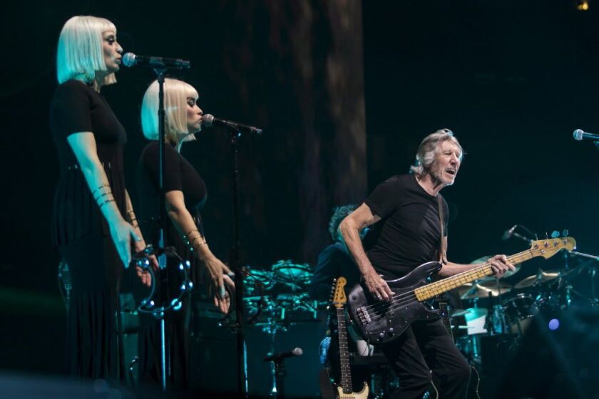 Roger Waters, backed by Jess Wolfe and Holly Laessig of Lucius, performs at the United Center on July 22, 2017. | Ashlee Rezin/Sun-Times
