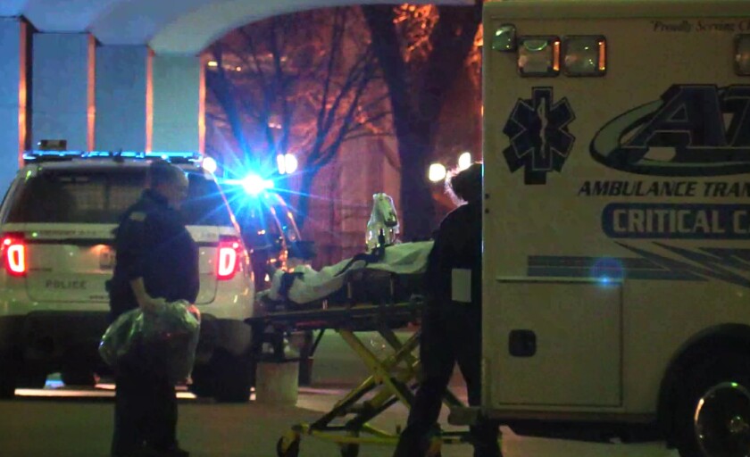 Paramedics take the 33-year-old woman with a gunshot wound to Stroger Hospital. | Network Video Productions