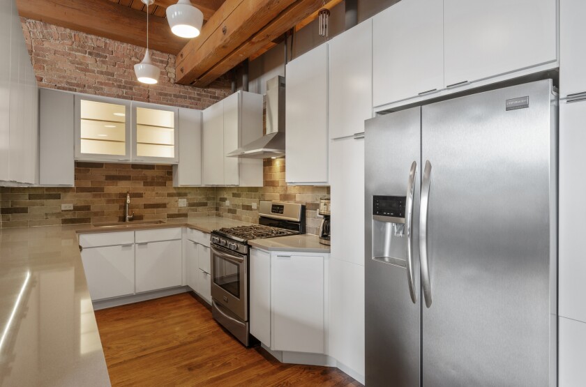 Galley kitchen with stainless steel appliances