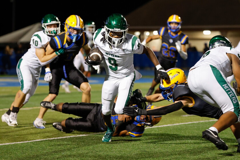 Glenbard West’s Keyante Johnson (9) carries the ball against Lyons.