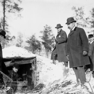 Police surround the dugout in the Indiana Dunes, where the Car Barn Bandits, also known as the Automatic Trio, were found hiding.