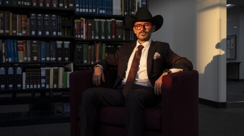 Enrique Espinoza, immigration attorney at the Illinois Institute of Technology's Chicago-Kent College of Law, sits inside the school's library on Thursday.