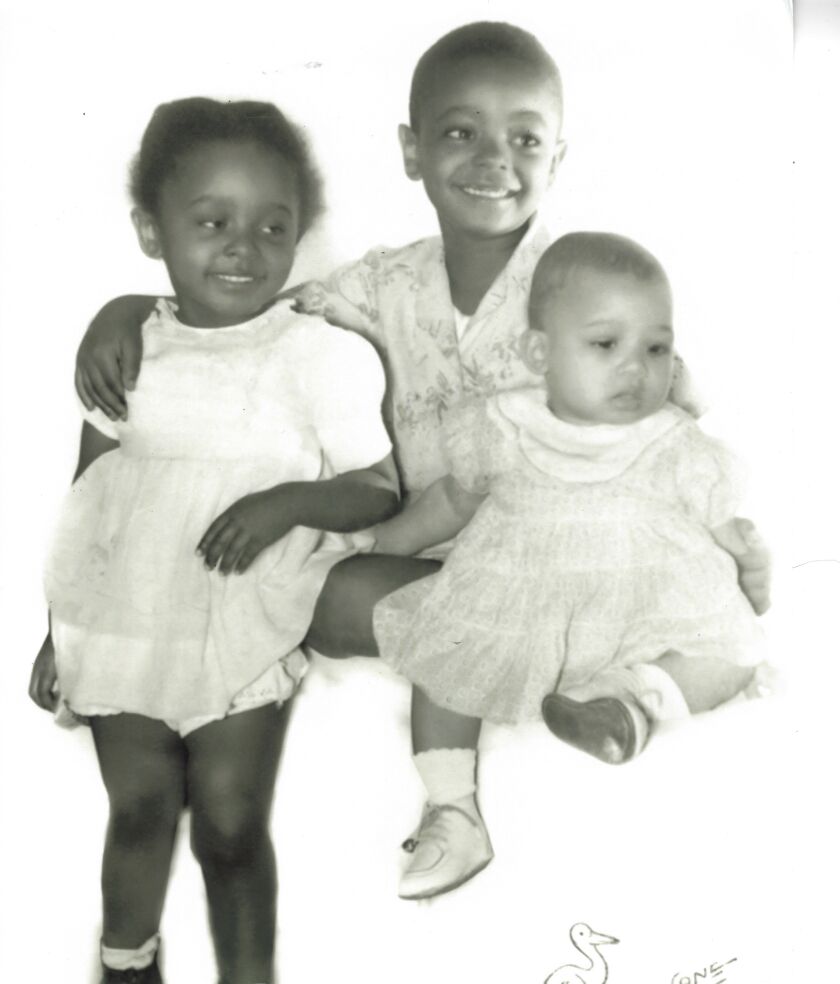 Wilton Gregory, here, with his two siblings Elaine (left) and Claudia, was raised by his mother, Ethel Duncan Gregory, and his grandmother, Etta Mae Duncan, in an apartment complex in South Side Englewood during the 1950’s and ‘60s.