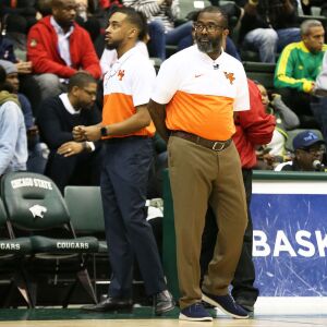 Young’s coach Tyrone Slaughter as the Dolphins play Morgan Park at Chicago State.