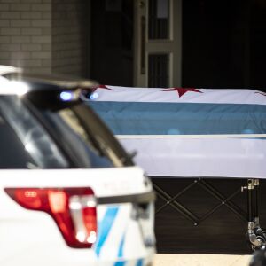 Funeral workers carry the casket to the hearse for Chicago Police Officer Officer Marco DiFranco at Cumberland Funeral Chapels, Thursday, April 9, 2020. DiFranco, 50, was a 21-year veteran of the department and represents the first officer to die from complications of the coronavirus.