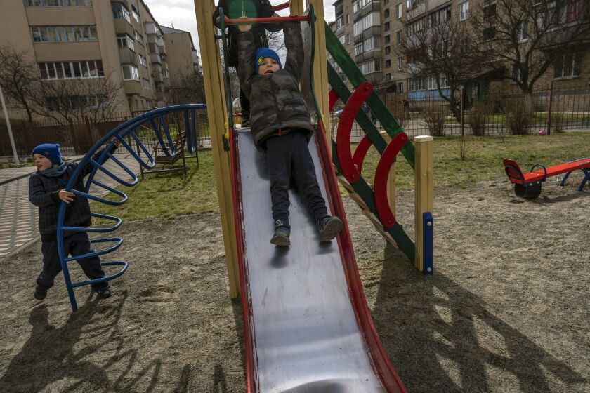 Vlad, 6, plays with his friends in Bucha.