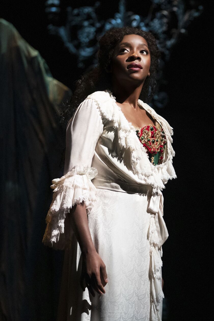 Emilie Kouatchou portrays Christine in a performance of “The Phantom of the Opera” in New York. 