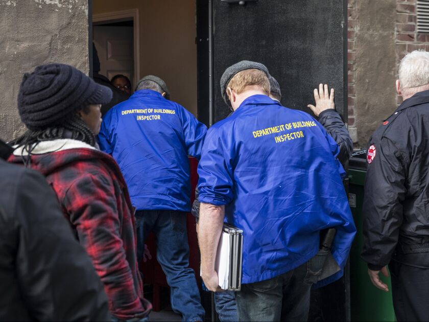 City officials enter the studio warehouse rented by singer R. Kelly at 219 N. Justine for an inspection, Wednesday afternoon, Jan. 16, 2019. | Ashlee Rezin/Sun-Times