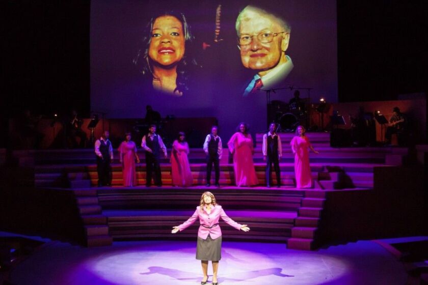 Rashada Dawan as Chaz Ebert with archival photos and the chorus of “The BlackWhite Love Play (The Story of Chaz & Roger Ebert)” in the background. (Photo: Danny Nicholas)