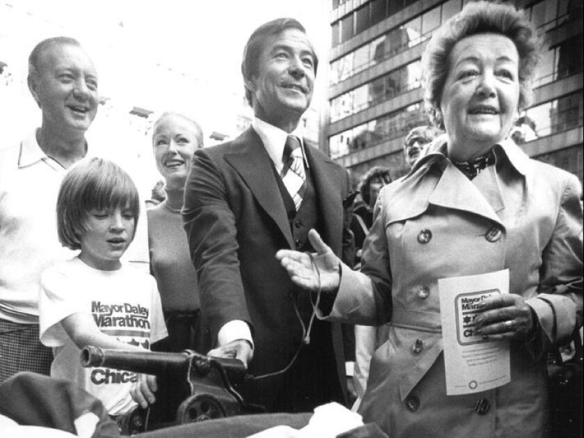 Eleanor Daley (right) on the reviewing stand at the Daley Center Plaza with Mayor Michael Bilandic (from left), his wife, Heather, and marathon organizer Lee Flaherty at the first Mayor Daley Marathon in 1977. Flaherty founded the marathon and asked his l