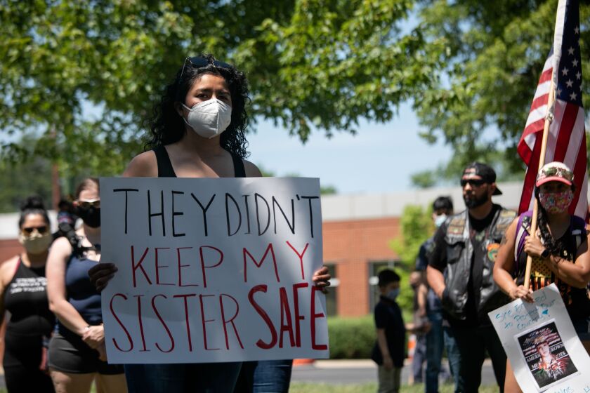 Eli Morales, a service member, gathers with community members and veterans near the Illinois National Guard’s Recruiting Office at 1551 N. Kedzie Ave. on July 3, 2020 to demand justice for Pfc. Vanessa Guillen, who was killed at Fort Hood in Texas.