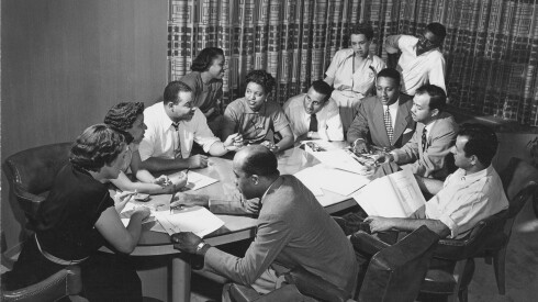 Ebony Magazine Editorial Meeting with Freda DeKnight, Publisher John Johnson, Editor Ben Burns, Leroy Wimbush, taken in their offices in a converted funeral parlor, Chicago, Illinois.