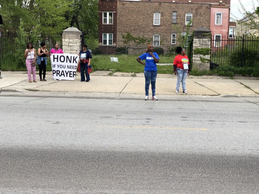 Community members on Saturday along the route of the Prayer on the 9 anti-violence march.