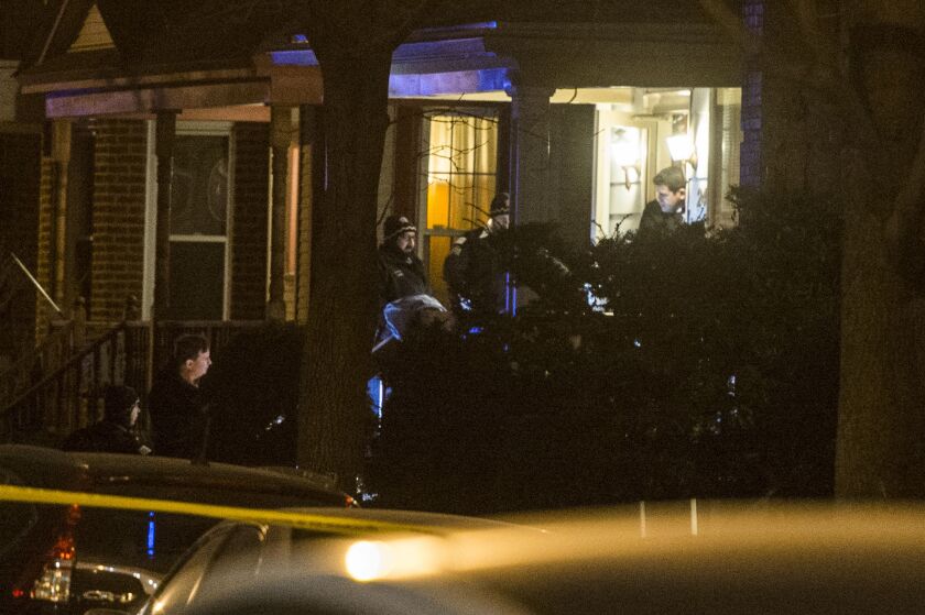 Police investigate an attempted home invasion that left one suspect dead and one on the run in the 2400 block of West Eastwood. | Tyler LaRiviere/Sun-Times
