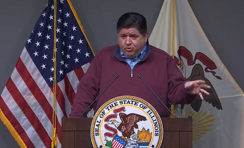 Gov. J.B. Pritzker talks to reporters at a news conference in Springfield on Tuesday.