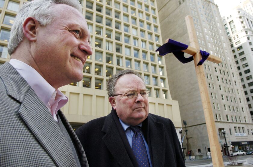Attorney John Mauck of Mauck & Baker (left).