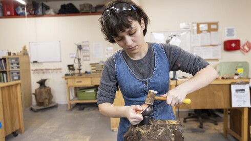 A student at Lillstreet Art Center sculpts a piece of sheet metal. The center celebrated its 50th anniversary on December 5, 2025. | Manuel Martinez/WBEZ