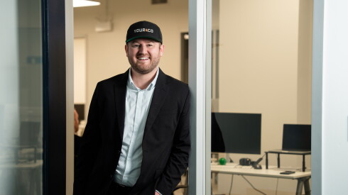 Yourco CEO Brodie Meyer stands in a doorway for a portrait, at the company's office in the Loop.