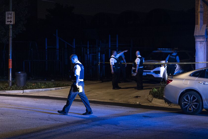 Police investigate the scene where at least four people were shot near 2245 S Willard St in Little Village, Wednesday, June 30, 2021.