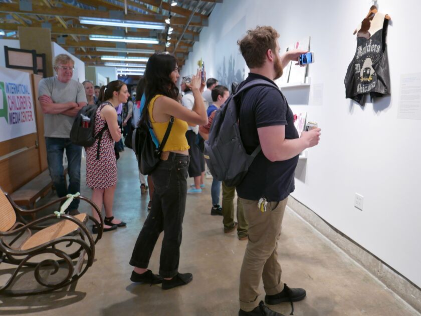 About 300 people attended the May 30th opening of “History Lessons: Everyday Objects from Chicago Public Housing,” a new exhibit running through July at the Chicago Public Housing Museum, 625 N. Kingsbury. | Richard Cahan/National Public Housing Museum