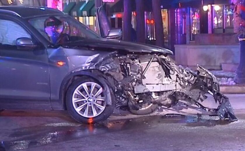 Authorities investigate after a car slammed into an Evanston restaurant Friday evening. | Network Video Productions