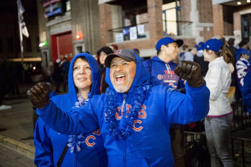 Fans outside Wrigley Field celebrate the Cubs’s Game 5 World Series victory. | Santiago Covarrubias / Sun-Times