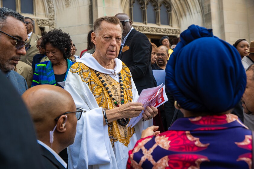 Father Pfleger Hands Out Flyers Outside of St. Sabina Church, at 1210 W. 78TH pl., On Sunday, June 1, 2025.