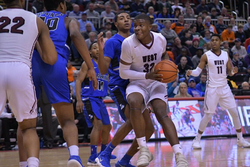 Bellville West’s EJ Liddell (32) runs into the lane against Larkin Friday 03-16-18. Worsom Robinson/For the Sun-Times.