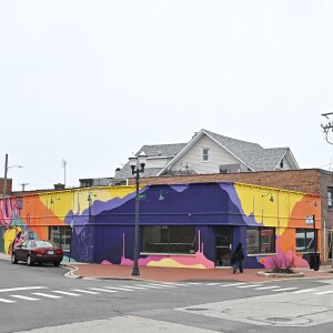 A mural painted by EPIC UNO is on a building in Highwood.