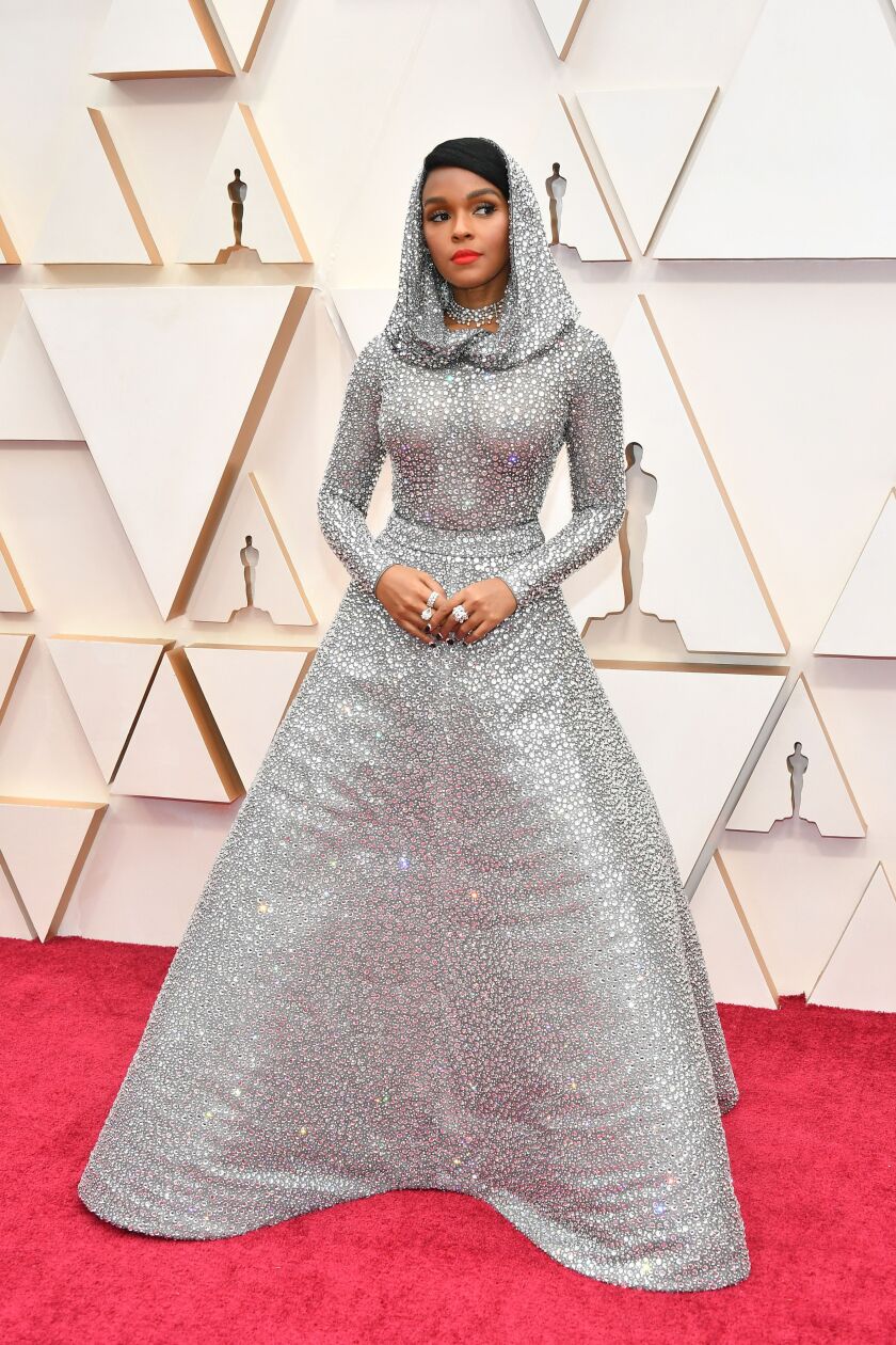 Janelle Monae glitters in a Ralph Lauren gown that features nearly 170,000 Swarovski crystals as she arrives on the red carpet at the Oscars on Sunday night.