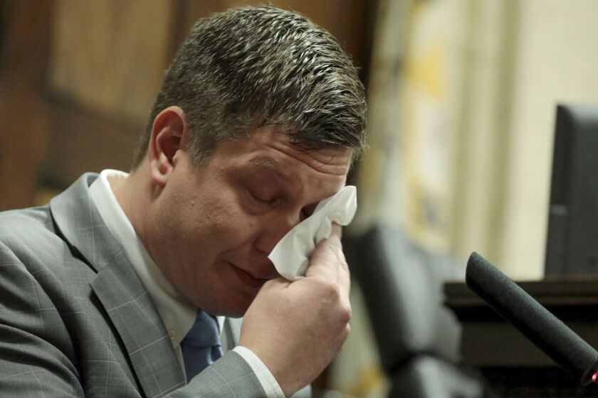 Chicago Police Officer Jason Van Dyke dabs his eyes as he testifies in his murder trial on Tuesday for the shooting death of Laquan McDonald. | Antonio Perez/Chicago Tribune pool photo