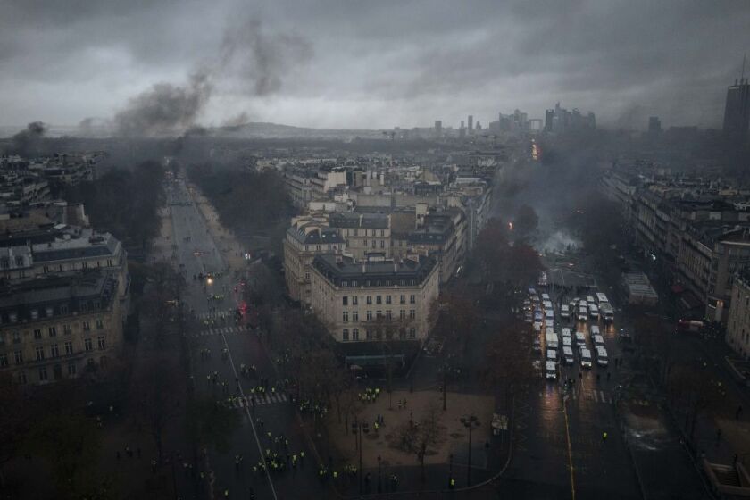 Avenues leading to the Arc de Triomphe are pictured from the top of the Arc de Triomphe on the Champs-Elysees avenue during a demonstration Saturday, Dec.1, 2018 in Paris. A French protest against rising taxes and the high cost of living turned into a rio