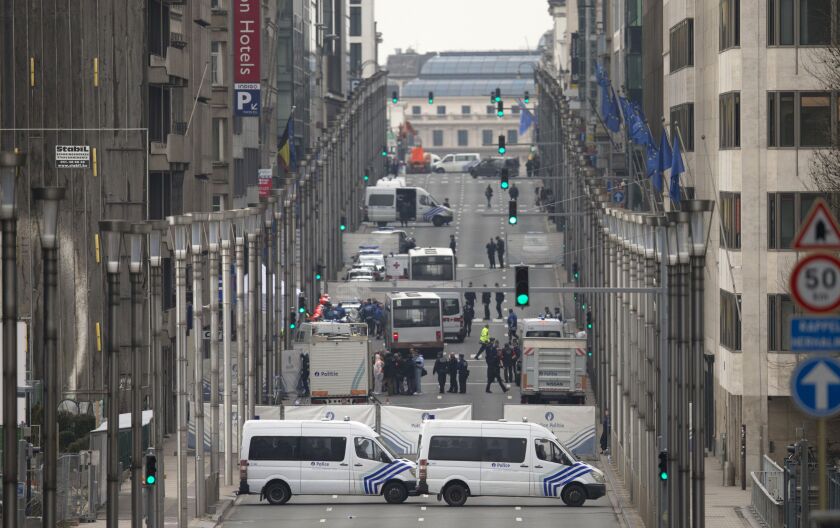 Emergency services and police work around a metro station after an explosion in Brussels on Tuesday. | Virginia Mayo/Associated Press