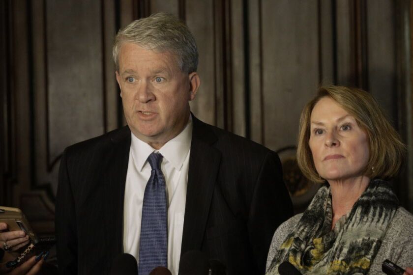 House Minority Leader Jim Durkin, R-Western Springs, left, and Illinois Senate Minority Leader Christine Radogno, R-Lemont, right, speak to reporters outside Illinois Gov. Bruce Rauner’s office at the Illinois State Capitol during veto session Tuesday, No