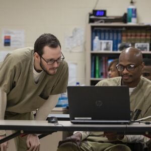 Detainee Matchew Luchins watches as Oscar Grissett participates in the International Online Chess Tournament for Prisoners at Cook County Jail, Tuesday morning, Aug. 6, 2019.