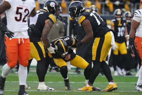Pittsburgh Steelers quarterback Aaron Rodgers is helped up off the field after a hit by the Cincinnati Bengals during the first half Sunday, Nov. 16, 2025, in Pittsburgh.