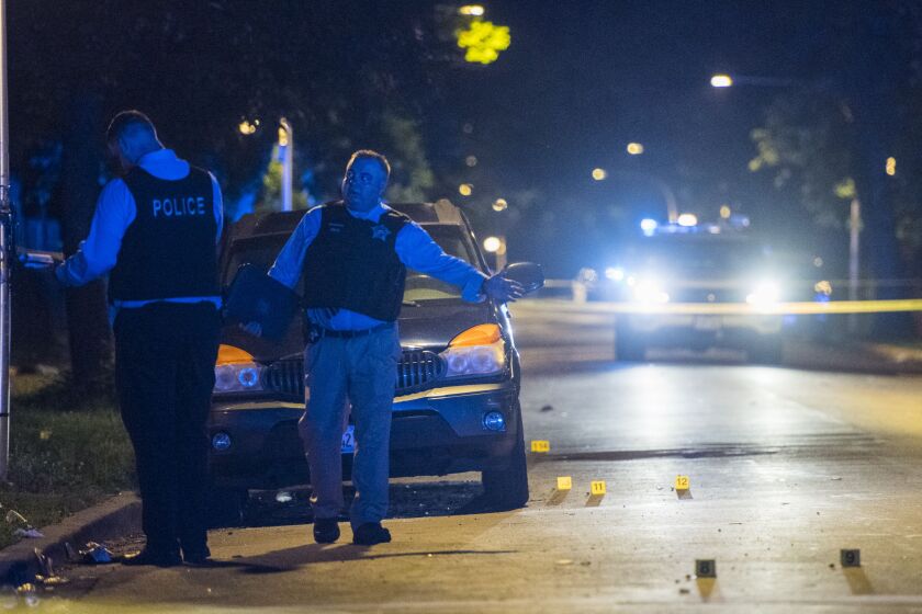 Police investigate six people shot Sunday night in the 3400 block of West Walnut Avenue. | Tyler LaRiviere/Sun-Times