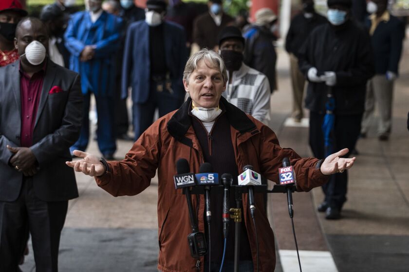 Pastor Charles Mironas, of Hope Community Bible Church, joins Willie Wilson and dozens of other pastors and religious leaders for a press conference outside the Thompson Center to call on Gov. J.B. Pritzker to allow churches to reopen amid the ongoing coronavirus pandemic, Thursday morning, May 14, 2020.