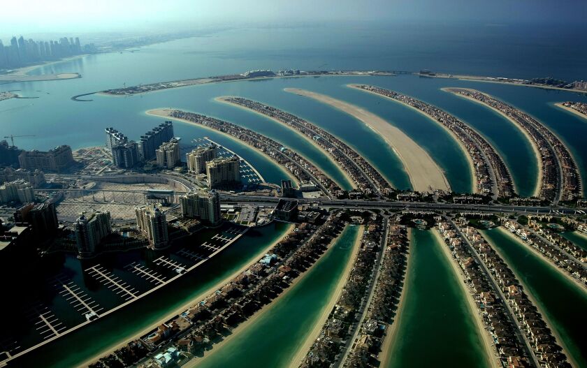 A picture shows a partial aerial view of the man-made Palm Jumeirah island built by Nakheel property giant off the coast of the Gulf emirate of Dubai on December 17, 2009. | MARWAN NAAMANI/AFP/Getty Images)