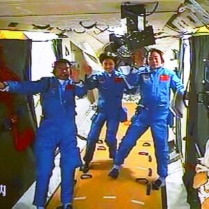 Chinese astronauts, from left, Liu Wang, Liu Yang and Jing Haipeng wave while aboard the orbiting Tiangong-1 space station. | Beijing Aerospace Control Center/Xinhua via AP file