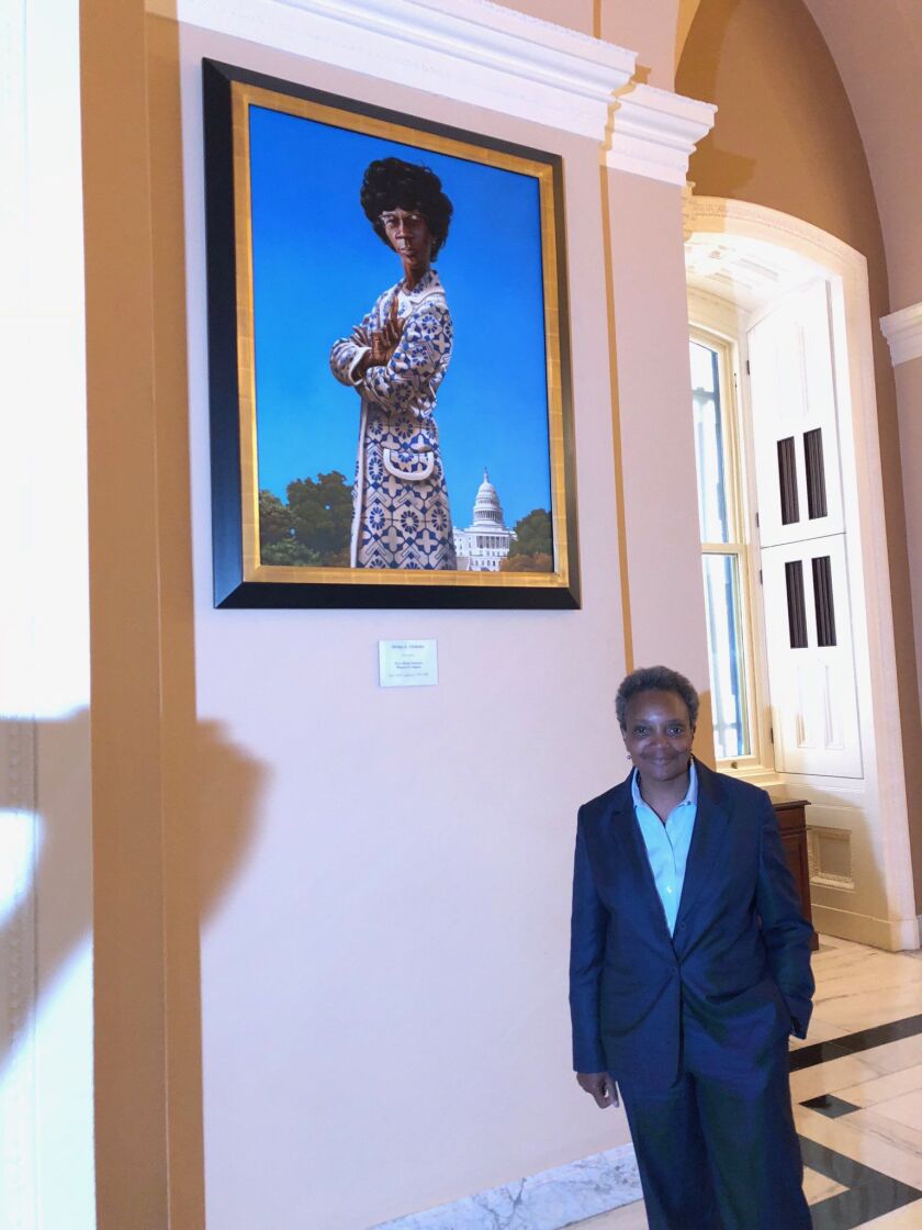 Mayor-elect Lori Lightfoot passed the portrait of Shirley Chisholm, the New Yorker who was the first African American woman to serve in Congress and the first African American to seek the presidency. | Lynn Sweet/Sun-Times photo