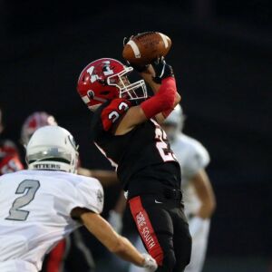 Maine South’s Dan Lazic (23) makes the catch against Glenbard West’s Sean Michel (2). Kevin Tanaka/For the Sun-Times.